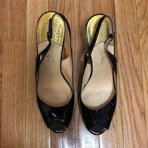Cole Haan black patent leather slingbacks.